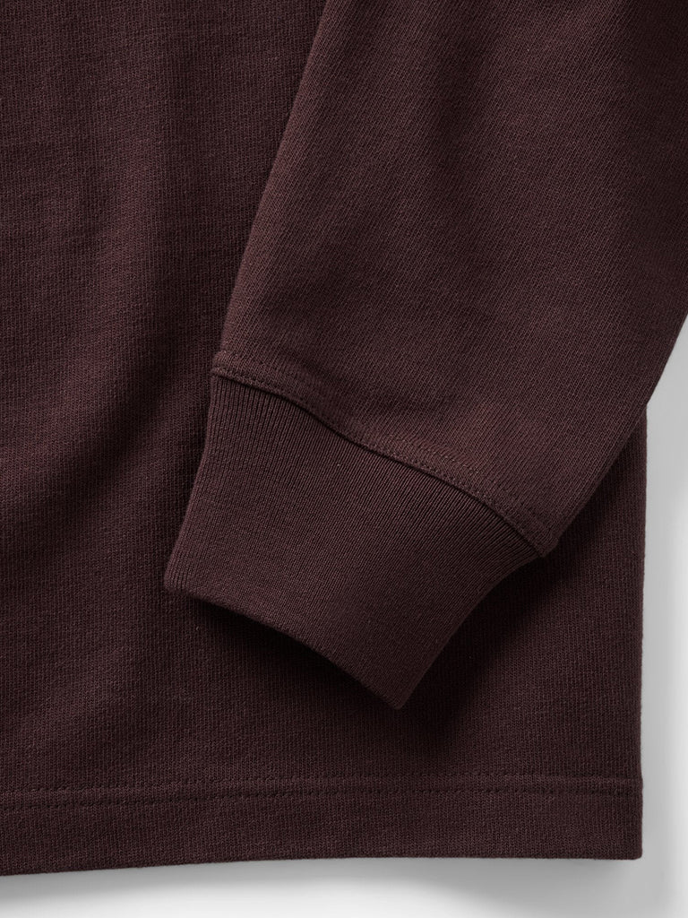 Close-up of a burgundy shirt showing the texture and cuff