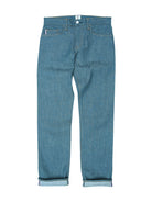 A pair of medium-wash blue denim jeans with rolled cuffs, shown flat against a plain white background.