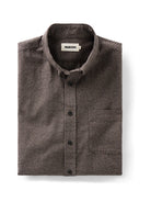 A folded brown houndstooth button-down shirt 